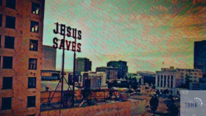 "Jesus saves" sign in urban setting